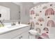 Clean, well-lit bathroom featuring a modern vanity, toilet, and decorative shower curtain at 5119 Moselle Ave, Fort Mill, SC 29707
