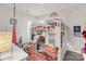 Creative room with a unique play structure, rainbow decor, and fun furnishings at 5119 Moselle Ave, Fort Mill, SC 29707