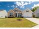 Charming single-Gathering home featuring a brick and siding facade with a manicured lawn at 5119 Moselle Ave, Fort Mill, SC 29707