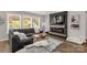 Inviting living room with large windows, comfortable seating, and a modern fireplace at 5119 Moselle Ave, Fort Mill, SC 29707