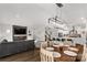 Spacious living area with fireplace, dining table, and staircase creating an inviting atmosphere at 5119 Moselle Ave, Fort Mill, SC 29707
