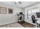 Bright home office with a modern desk setup, ergonomic chair, and window with natural light at 5119 Moselle Ave, Fort Mill, SC 29707
