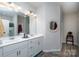 Bathroom featuring double sinks, modern fixtures, and a mirror at 530 Kiser Ln, Locust, NC 28097