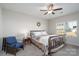 Comfortable bedroom with ceiling fan and window at 530 Kiser Ln, Locust, NC 28097