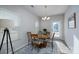 Bright dining area with natural light, elegant furnishings, and a view of the backyard at 530 Kiser Ln, Locust, NC 28097