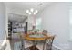 Dining area with a chandelier and views of the kitchen at 530 Kiser Ln, Locust, NC 28097