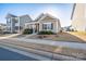 Inviting curb appeal with landscaped front yard, sidewalk, and craftsman-style architecture in residential neighborhood at 530 Kiser Ln, Locust, NC 28097
