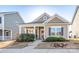 Charming single-story home with a covered porch, manicured lawn, and a welcoming front entrance at 530 Kiser Ln, Locust, NC 28097