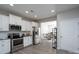 Bright kitchen with stainless steel appliances and an open layout connected to the dining area at 530 Kiser Ln, Locust, NC 28097