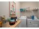 Functional laundry room with washer, dryer, shelving and ample space for storage at 530 Kiser Ln, Locust, NC 28097