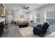 Cozy living room with ceiling fan, fireplace, and neutral décor at 530 Kiser Ln, Locust, NC 28097