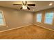 This cozy bedroom has multiple windows for natural light at 5319 Springdale Ave, Mint Hill, NC 28227