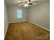 This cozy bedroom has multiple windows for natural light at 5319 Springdale Ave, Mint Hill, NC 28227