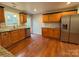 Well-lit kitchen with stainless steel appliances, granite countertops, and wooden cabinetry, perfect for cooking at 5319 Springdale Ave, Mint Hill, NC 28227