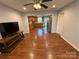 Open-concept living room showcasing hardwood floors at 5319 Springdale Ave, Mint Hill, NC 28227