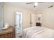 Bedroom with attached bath showcasing open doorways, neutral tones, and ample natural light at 5329 Glenbrier Dr, Charlotte, NC 28212