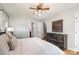 Comfortable bedroom with hardwood floors, a ceiling fan, and ample storage, providing a serene space at 5329 Glenbrier Dr, Charlotte, NC 28212