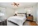 Cozy bedroom with a ceiling fan, natural light, and neutral décor, offering a relaxing retreat at 5329 Glenbrier Dr, Charlotte, NC 28212