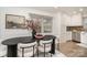 Bright dining area with a modern table, comfortable seating, and adjacent white cabinets, great for Gathering meals at 5329 Glenbrier Dr, Charlotte, NC 28212