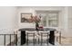 Elegant dining room with a modern table, stylish chairs, and a large window, perfect for gatherings at 5329 Glenbrier Dr, Charlotte, NC 28212