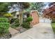 Two-story home with a detached two-car garage, brick siding, and well-maintained landscaping at 5329 Glenbrier Dr, Charlotte, NC 28212