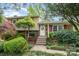 Charming two-story home featuring brick accents, mature landscaping, and a welcoming front porch at 5329 Glenbrier Dr, Charlotte, NC 28212