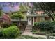 Charming split-level home with brick and siding, landscaped yard, and a welcoming front entrance with lovely steps at 5329 Glenbrier Dr, Charlotte, NC 28212
