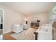 Spacious living room featuring hardwood floors, comfortable seating, and tasteful decor, creating an inviting space at 5329 Glenbrier Dr, Charlotte, NC 28212