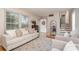 Spacious living room with modern decor, light-colored walls, hardwood floors, and a view of the entrance and staircase at 5329 Glenbrier Dr, Charlotte, NC 28212