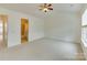 Bright, neutral carpeted bedroom with ceiling fan at 5430 Dockery Dr, Charlotte, NC 28209