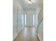 Light and bright entryway with light hardwood flooring, white trim, and a front door with sidelights at 5430 Dockery Dr, Charlotte, NC 28209