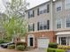 Beautiful townhome with brick accents, a manicured lawn, and a one car garage at 5430 Dockery Dr, Charlotte, NC 28209