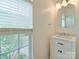 Charming powder room with window, vanity, and modern light fixture at 5430 Dockery Dr, Charlotte, NC 28209