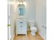 Cozy powder room featuring a modern vanity, mirror and lighting at 5430 Dockery Dr, Charlotte, NC 28209