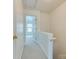 Hallway with access to bedroom featuring neutral carpet, white walls, and a view to the bedroom at 5430 Dockery Dr, Charlotte, NC 28209