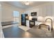 Modern kitchen with white cabinets, black appliances, countertops, and an island for extra prep space at 5430 Dockery Dr, Charlotte, NC 28209
