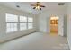 Spacious main bedroom with vaulted ceiling and large windows allowing for natural light at 5430 Dockery Dr, Charlotte, NC 28209