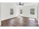 Bright bedroom with hardwood floors, large windows, and recessed lighting at 676 Chapel Hill Dr, Troy, NC 27371