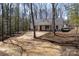 Beautiful home nestled amongst the trees, featuring a covered porch and stylish exterior details at 676 Chapel Hill Dr, Troy, NC 27371