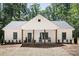 Charming home features a welcoming front porch with rocking chairs and a well-maintained yard at 676 Chapel Hill Dr, Troy, NC 27371