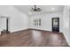 Spacious living room with wood floors, vaulted ceilings, and natural light from a large window at 676 Chapel Hill Dr, Troy, NC 27371