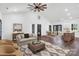 Open-concept living room showcases modern decor leading to the kitchen and dining area at 676 Chapel Hill Dr, Troy, NC 27371