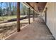 Long covered porch with wood columns and ceiling fans providing an outdoor living space at 676 Chapel Hill Dr, Troy, NC 27371