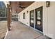 Covered porch with wood columns and ceiling fans providing an outdoor living space at 676 Chapel Hill Dr, Troy, NC 27371