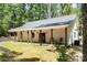 The rear of the house shows the covered back porch and outdoor living space at 676 Chapel Hill Dr, Troy, NC 27371