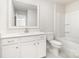 A modern bathroom features a vanity with a single sink, a toilet, and a tub shower at 7001 New Town Rd, Waxhaw, NC 28173