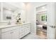 Bright bathroom with double vanity, marble countertops, and view into the spacious main bedroom at 7001 New Town Rd, Waxhaw, NC 28173