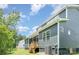 Well-maintained home exterior featuring a screened porch, lush lawn, and mature trees for added privacy at 7001 New Town Rd, Waxhaw, NC 28173