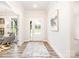 Bright and airy foyer features hardwood floors, a decorative rug, and a welcoming entrance at 7001 New Town Rd, Waxhaw, NC 28173