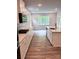 Modern kitchen with white cabinets, stainless steel appliances, an island, and an open layout at 7001 New Town Rd, Waxhaw, NC 28173